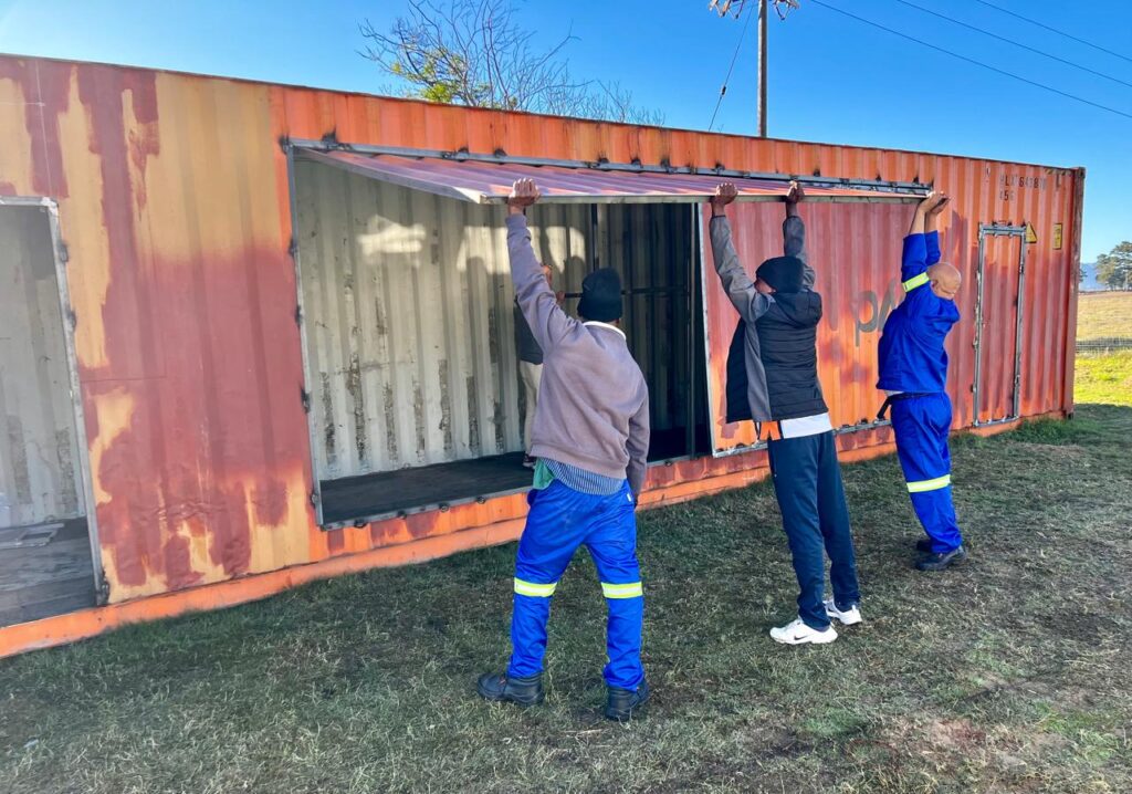 Recycled container being refurbished as sanitation hub