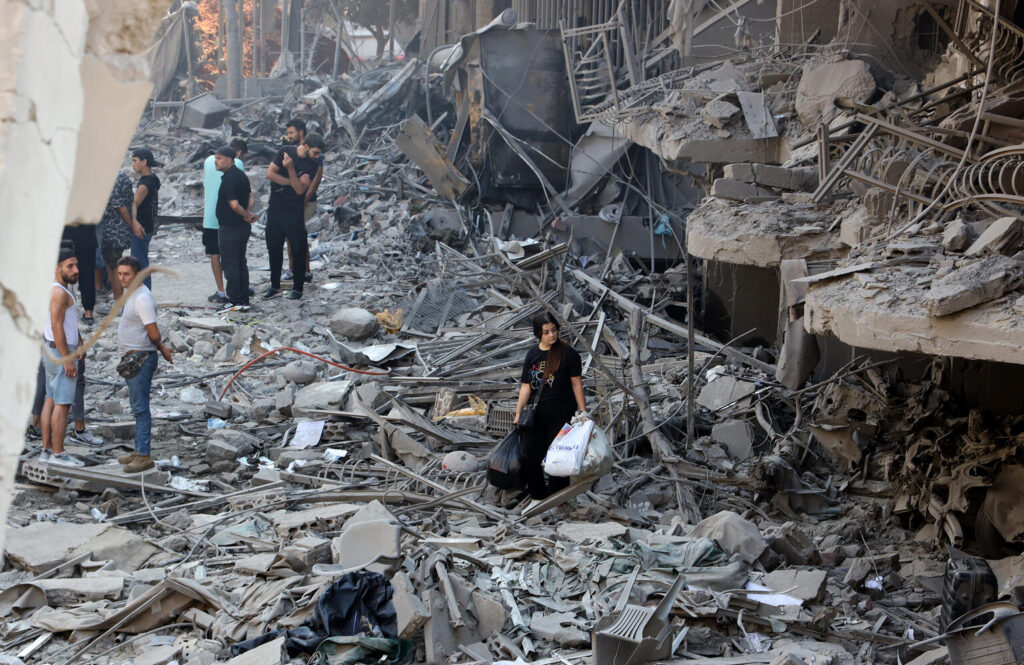 On September 29, 2024, people inspect the debris of buildings destroyed by airstrikes on the 27th, which targeted the Haret Hreik neighborhood in Beirut's southern suburbs. Photo by Ramzi Haidar.