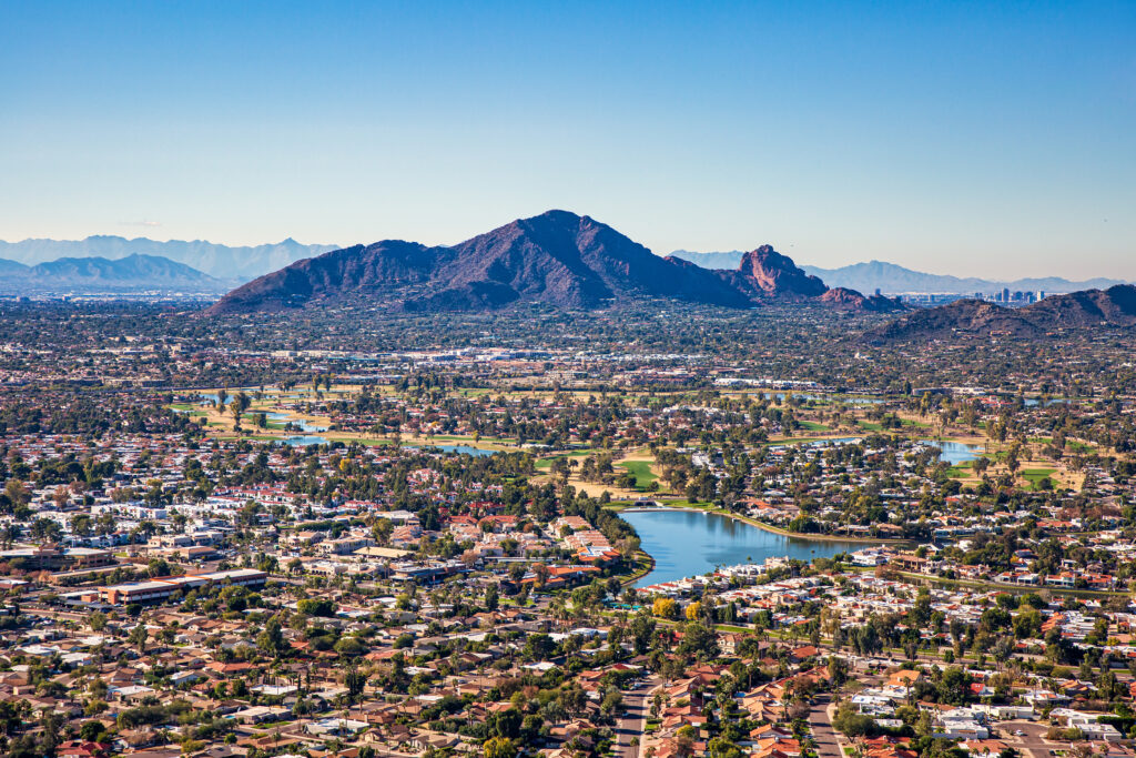 Aerial view from above Scottsdale looking SW towards Camelback Mountain and downtown Phoenix, Arizona