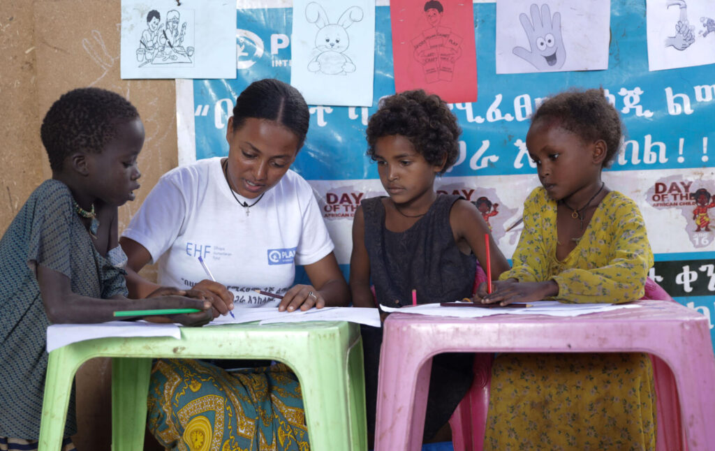 Zemenay Getu Early Childhood teacher with children in Azerti Kitili IDP in Benshangul Gumz Regional State.