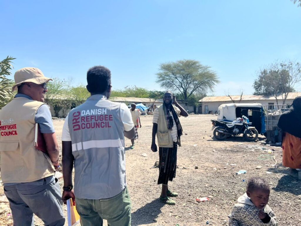 Arriving at the displacement site: The DRC team is greeted by Mekbul Dequro, a representative from the local government.